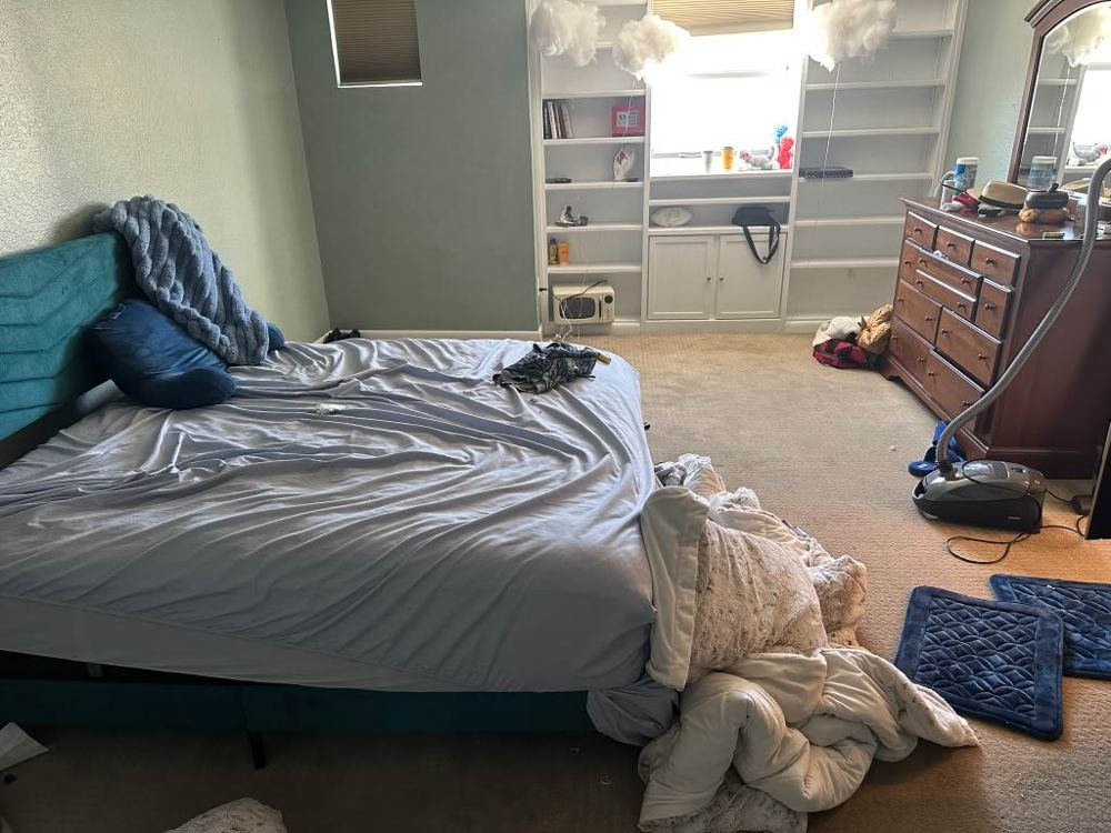 Bedroom before cleaning by Amanda’s Elite Services