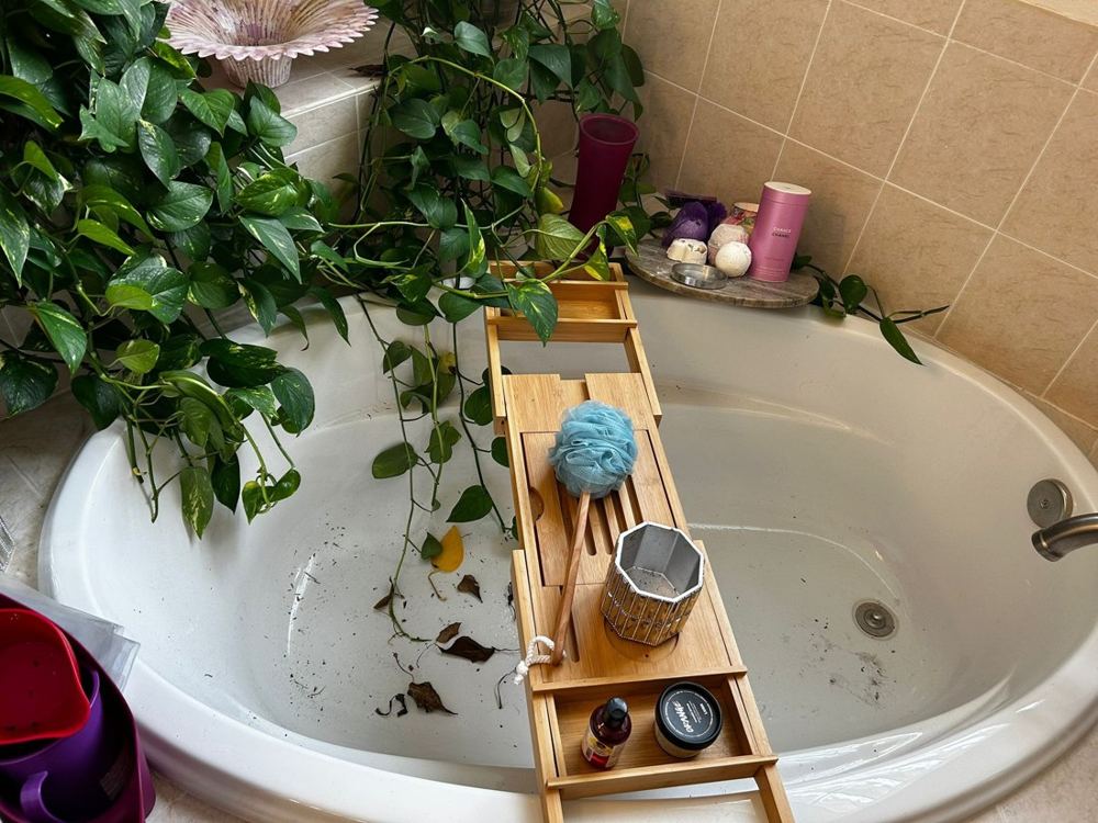 Bathtub before cleaning by Amanda’s Elite Services